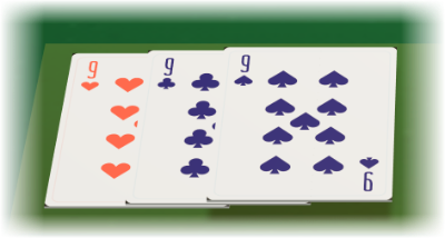 A set laid face up on the green felt: the nine of hearts, the nine of clubs and the nine of spades side by side under the table lamp.